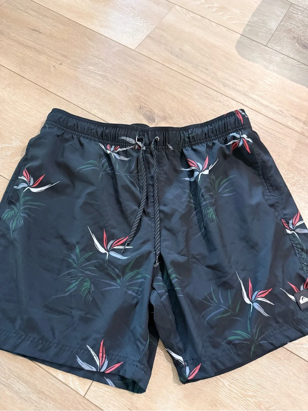 Quiksilver Black Swim Trunks with Red & White Floral Accent